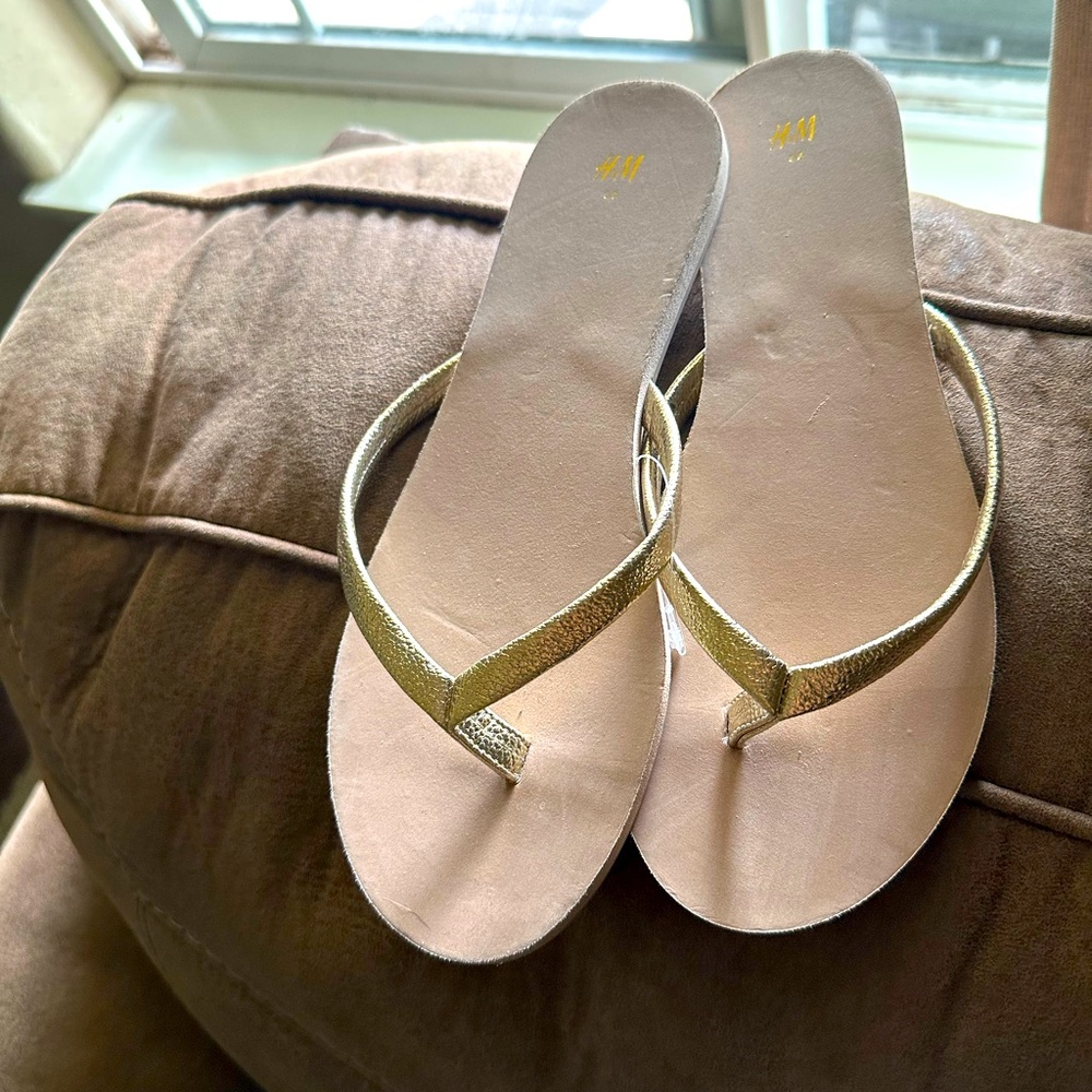 H&M flip flops. Gold strap